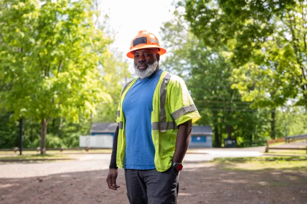 CWA Local 1298 Frontier worker with hard hat standing on a road